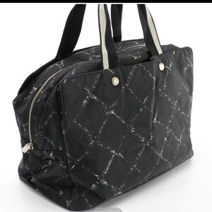CHANEL Black Quilted Travel Bag with Diamond Pattern